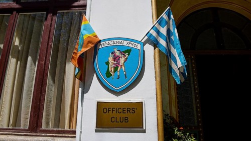 Building with sign of the officers' club, Greek flag and coat of arms, harbour area, Rhodes Town,