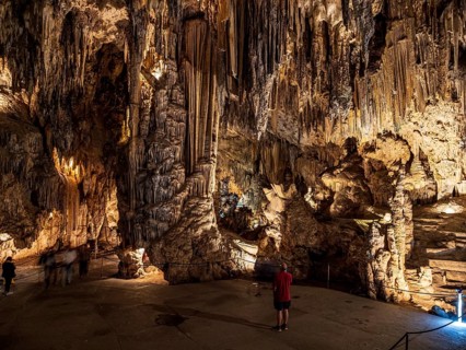Cueva de Nerja, illuminated cave, large stalagmites and stalagtites, Nerja, Andalusia, Spain