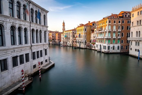 View of the Grand Canal at sunset, long exposure, picturesque evening mood with palazzos on the