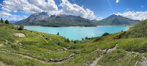 Panoramic view of Jardin Alpin in the foreground, Lac du Mont Cenis reservoir behind, Mont Cenis