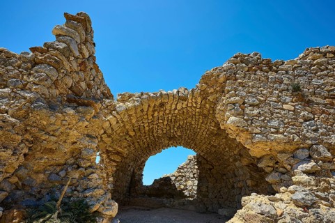 Ancient stone arch under a clear blue sky, Abandoned village, Lost place, Pyli, Paleo Pyli,