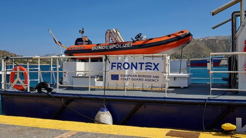FRONTEX coast guard boat at the dock with orange dinghy on board, Lakki, Leros, Dodecanese, Greek