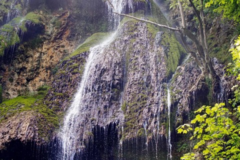 Elevated view of the Urach waterfall flowing over moss-covered rocks, Bad Urach