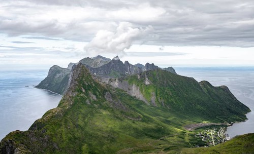 View of mountain peaks on the headland of Fjordgård with peak Segla, fjords Øyfjorden and