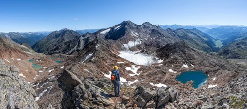 Mountain panorama, mountaineer in rocky high mountain landscape at the Rotgratscharte, view of