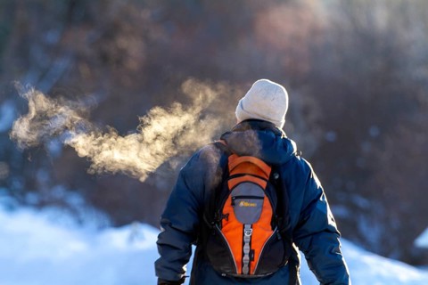 Person walking in very cold weather, Visual effect of the steam seen when exhaling in cold weather.