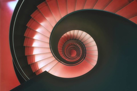 Modern red spiral staircase in an educational building, Zurich, Switzerland