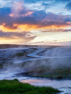 Curved wooden path, sulphur vapour, Hveravellir geothermal area, sunset, Icelandic highlands,