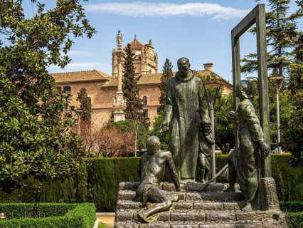 Statue of Johannes von Gott, Granada, royal hospital in the back, Granada, Andalusia, Spain