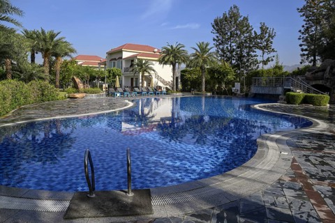 Swimming pool of the Resort De Coração, near Ramnagar, Corbett National Park, Uttarakhand State,
