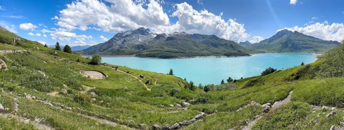 Panoramic view of Jardin Alpin in the foreground, Lac du Mont Cenis reservoir behind, Mont Cenis