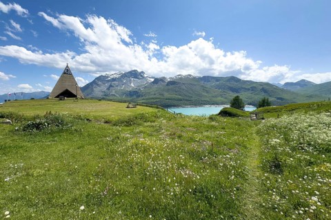 Panoramic view from plateau above Lanslebourg-Mont-Cenis to reservoir Lac du Mont Cenis left Museum