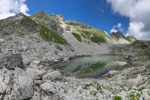 Koblatsee, a small mountain lake on the Koblat-Höhenweg in the nature reserve of the Allgäu High