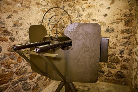 A historical gun mounted on a stone wall, War Museum, Military Museum, Tunnel Museum, Lakki, Leros,