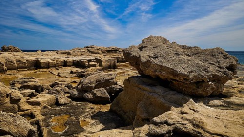 Large rocks along the coast under a clear sky, Oasis Beach, East Coast Rhodes, Rhodes, Dodecanese,