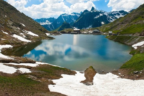 View from Swiss territory to Italian territory over mountain lake Lac du Grand Saint Bernard on top
