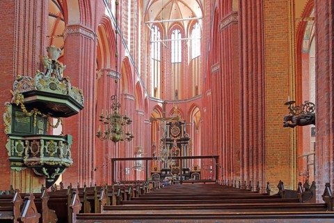 Interior view of the Gothic St. Nikolai Church with pulpit and pulpit bonnet, UNESCO, Brick Gothic,