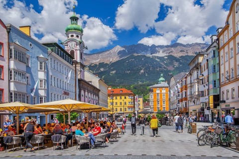 Street café on the pedestrian zone Maria-Theresien-Strasse in front of the Nordkette of the