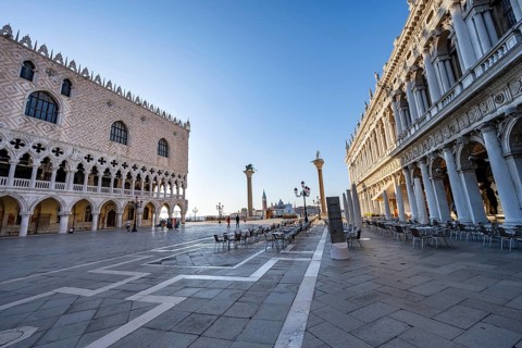 Chairs and tables of cafes at Piazetta San Marco, Doge's Palace and Colonna di San Marco and