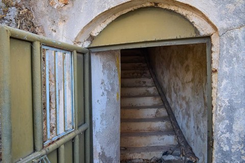 An open entrance with stairs leads into a dilapidated, secluded structure, Lost Place, Lago