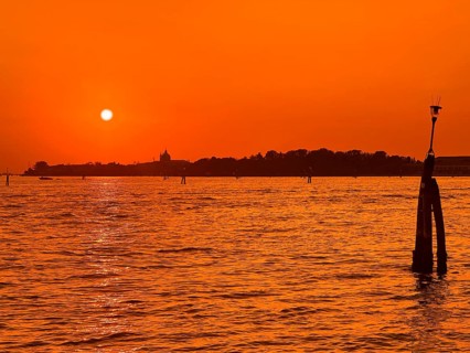 View over the lagoon to Venice at sunset, lagoon city of Venice, Veneto, Italy