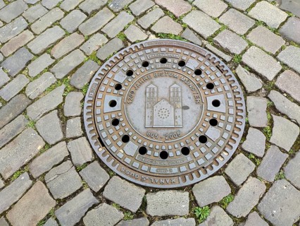 Manhole cover, manhole cover with the cathedral, cobblestones, Münster, Münsterland, North