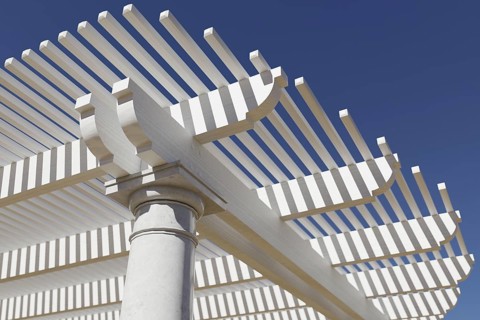 Detail abstract of A beautiful marble and wood pergola patio cover