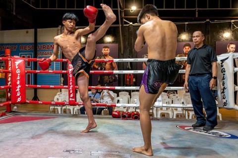 Thai boxing Muai Thai boxer in action, Pattaya, Thailand