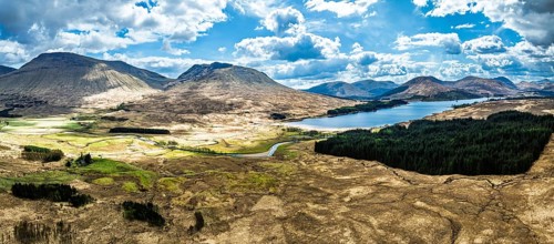 Panorama of Mountains and Moors over Loch Tulla and River Orchy from a drone, Highlands, Scotland,
