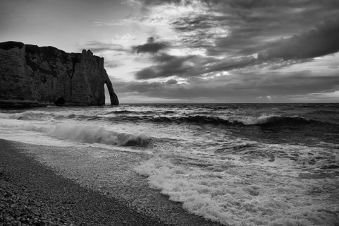 Surf in front of rock arch Falaise or Porte d'Aval, Étretat, sea, clouds, steep coast, cliffs,