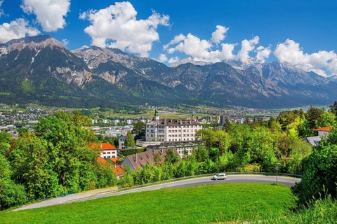 Ambras Castle on the outskirts of the city in front of the northern range of the Karwendel