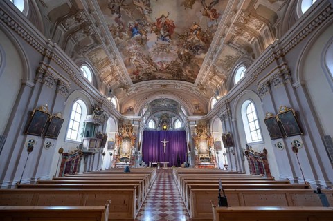 Interior with large purple Lenten cloth in front of the high altar, baroque parish church of St