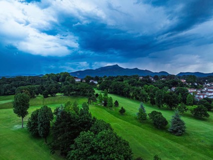 Sunset and storm clouds over Pyrenees and Saint-Jean-de-Luz from a drone, Nouvelle-Aquitaine,