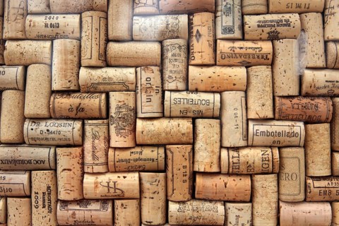 Corks from wine bottles laid as a regular pattern, wine corks, red wine