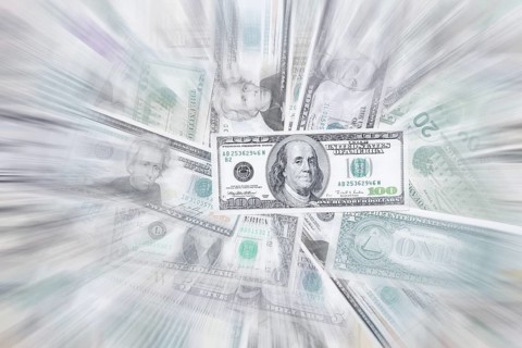Various US dollar notes in a pile, banknotes, zoom effect