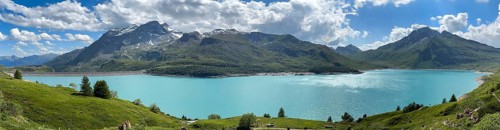 Panoramic view from plateau above Lanslebourg-Mont-Cenis with pass road to pass Alpine pass