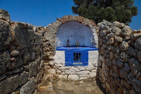 Ancient stone chapel in a peaceful, natural setting with clear blue skies, Artemis Temple, Artemis,