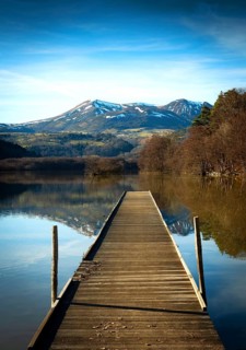 Lake Chambon in autumn, Massif of Sancy in the background, Regional Nature Park of the Volcanoes of
