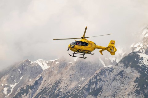 Rescue helicopter, emergency helicopter in flight, Schwaz, Tyrol, Austria