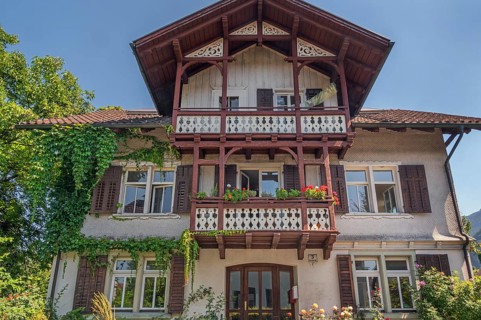 Old villa with wooden shingle façade, large balcony with floral decorations, around 1900, Dornbirn,