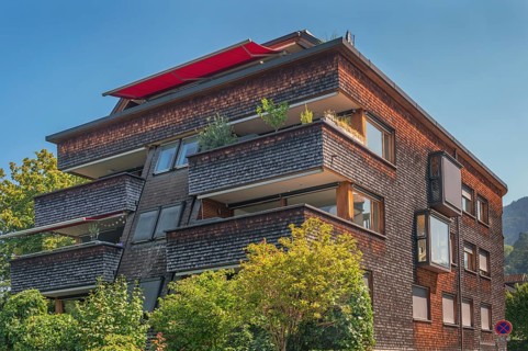 Modern house with wooden shingle façade, large green balcony, Dornbirn, Vorarlberg, Austria