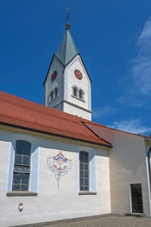 Church of the Assumption of the Virgin Mary with sundial, blue sky, Frauenzel, Allgäu, Bavaria,
