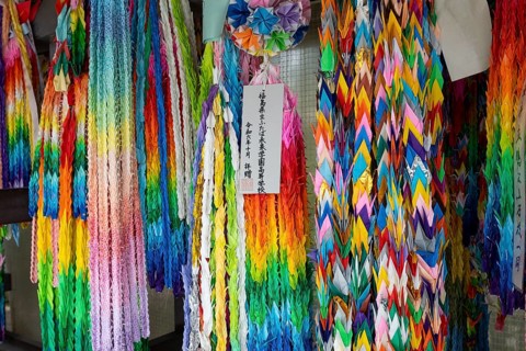Chains of colourful origami cranes made of paper as a sign of peace in the Peace Park, landmark,