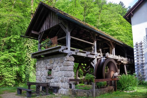 Rustic old mill in the countryside, surrounded by trees and wooden architecture, Stillensteinklamm
