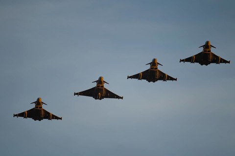 Eurofighter Typhoon four military fighter jet aircraft of the Royal air force RAF flying in