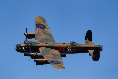 Avro Lancaster warbird military aircraft in Royal air force RAF colours flying, England, United