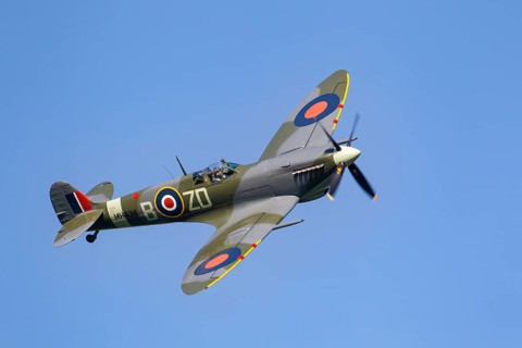 Supermarine Spitfire warbird military aircraft in Royal air force RAF colours flying, England,