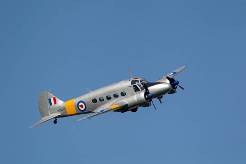Avro Anson warbird military aircraft in Royal air force RAF colours flying, England, United Kingdom