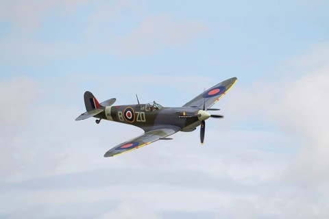 Supermarine Spitfire warbird military aircraft in Royal air force RAF colours flying, England,