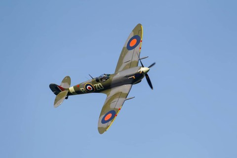 Supermarine Spitfire warbird military aircraft in Royal air force RAF colours flying, England,